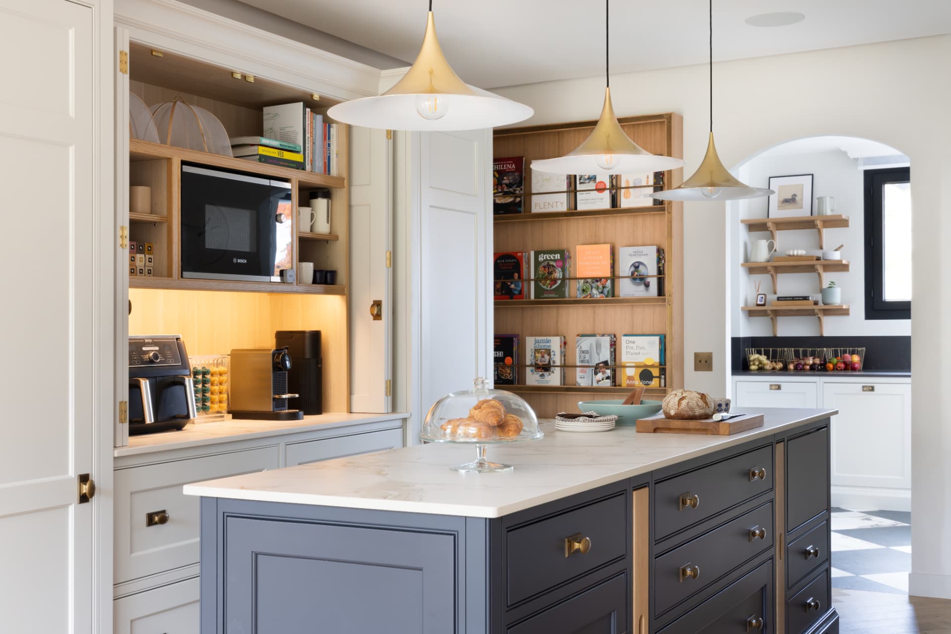 Lake Geneva House — kitchen island and breakfast station cabinetry with pocket doors open